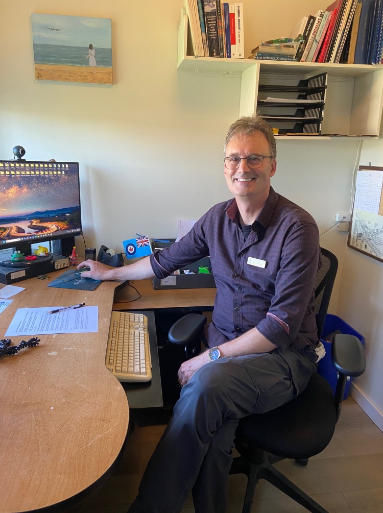 Stephen Hayter at a desk in his office
